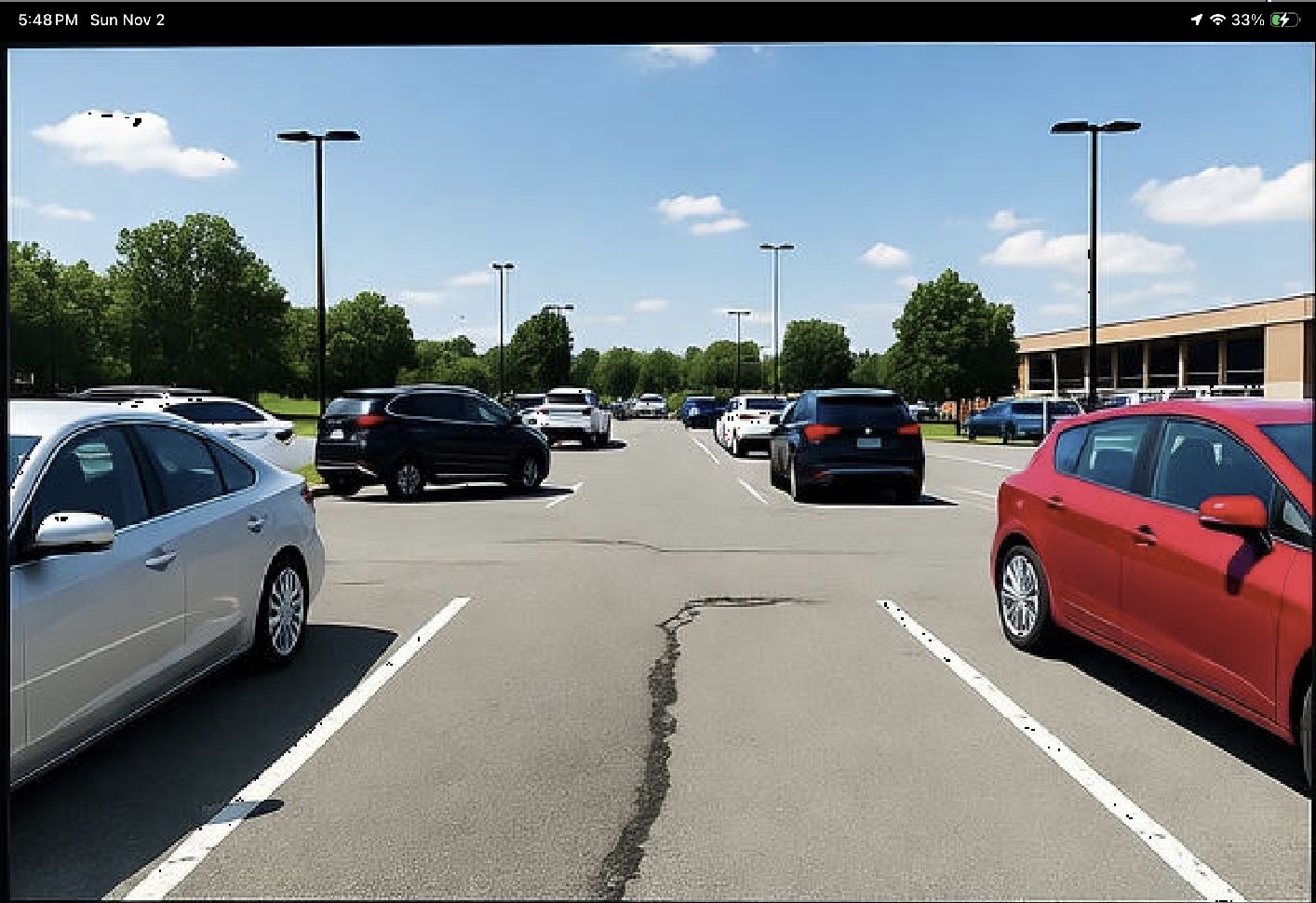 DrivePad Cam screen showing a parking-lot camera view
